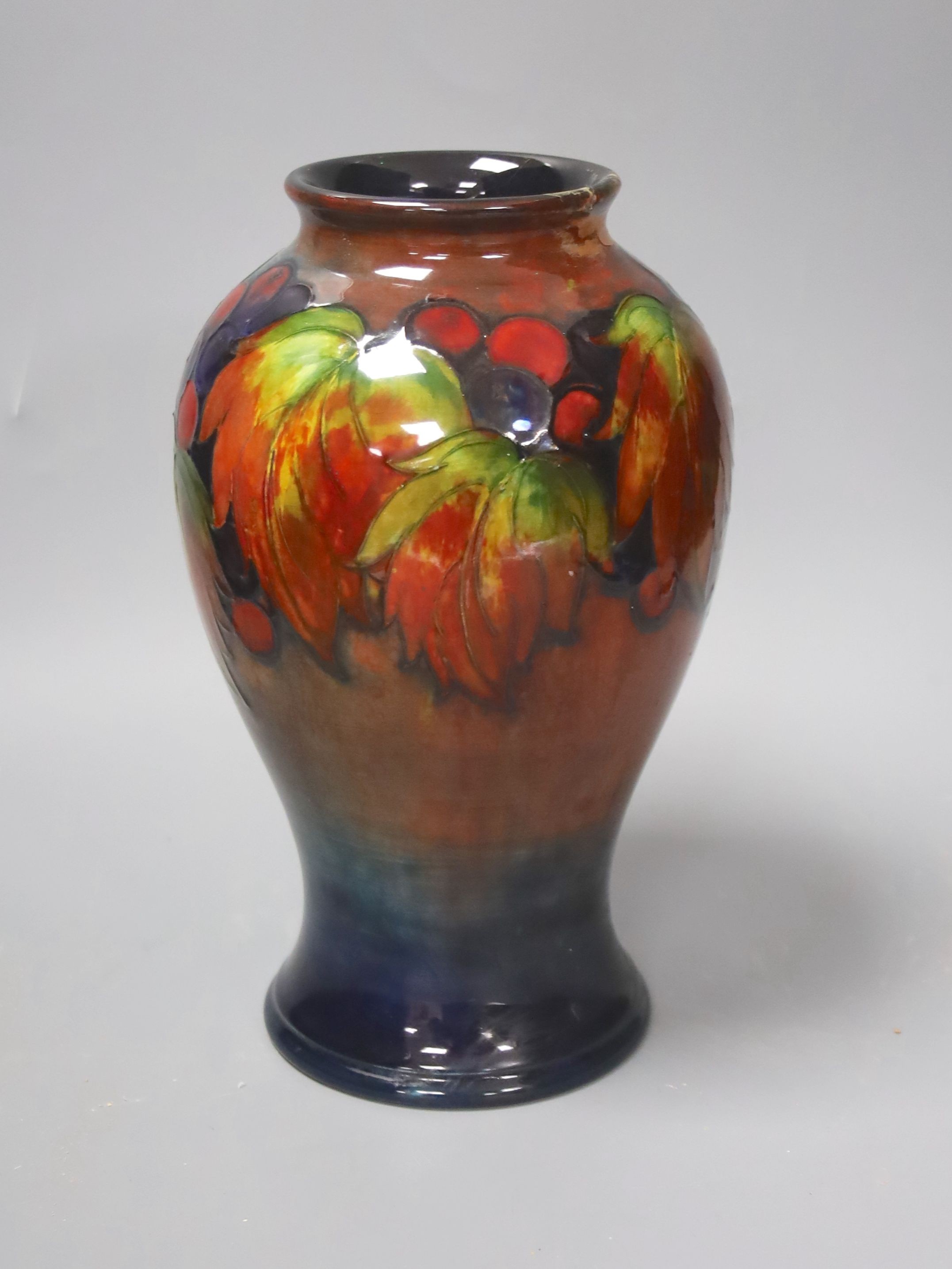 A Moorcroft flambe leaf and berry baluster vase (a.f.) 23.5cm